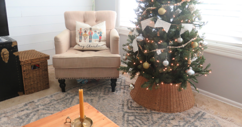 Christmas tree next to chair with Nutcracker pillow