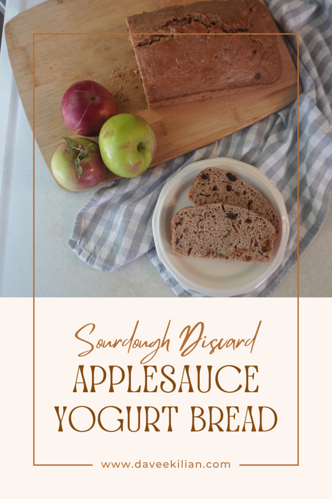 applesauce bread pin with 2 slices of bread on plate, apples on cutting board with rest of bread