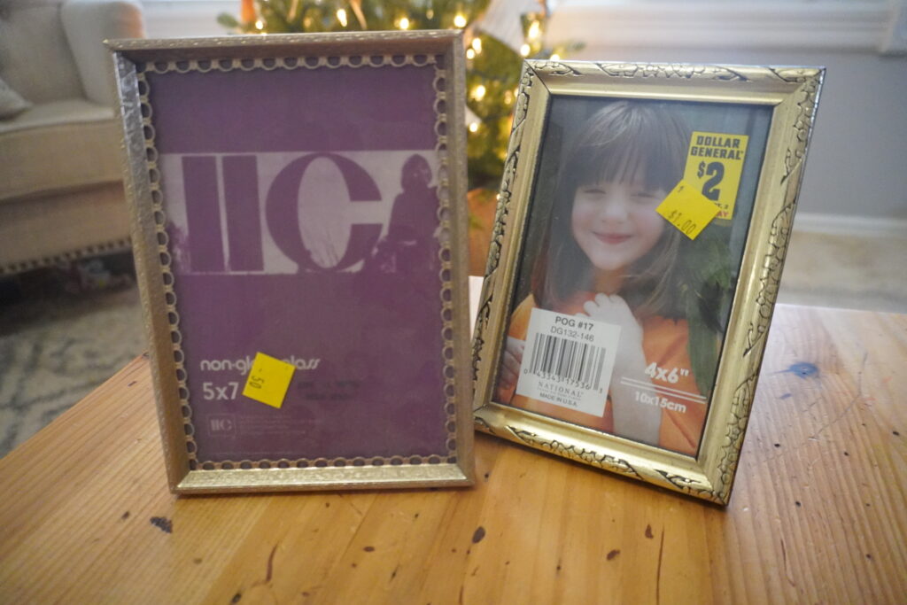 Two gold rimmed picture frames.
