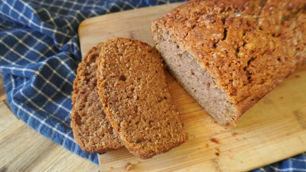 zucchini bread cut with 2 slices cut on board