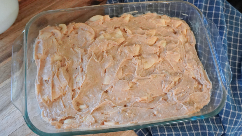 unbaked apple cake in pan